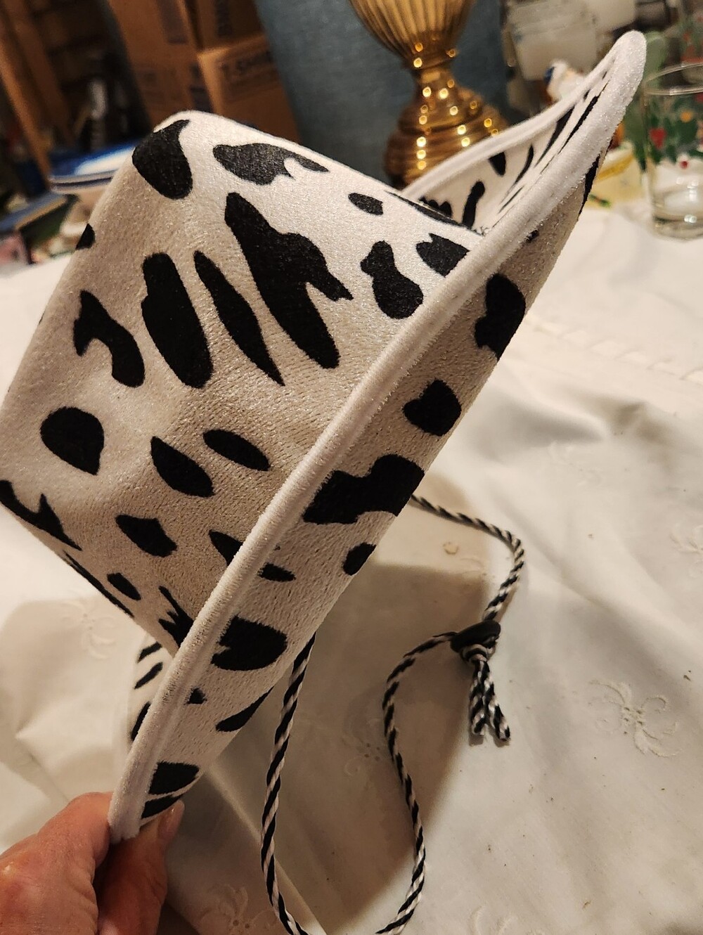 Beistle Cow Print Cowboy Hat featuring a classic white and black bovine pattern